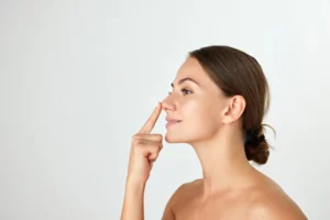 beautiful woman touching her nose