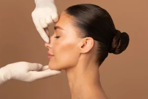 plastic surgeon examining nose