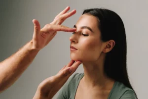 Doctor measuring a patients nose